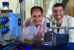 Prof Peter H. Seeberger (left) and Dr. Kerry Gilmore with their development - a continous flow photoreactor turning waste into Artesunate and three other medications.